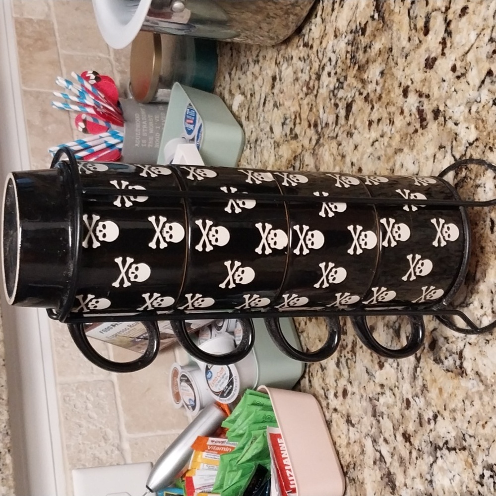 Signature brand stackable skull mugs. Used Gently.